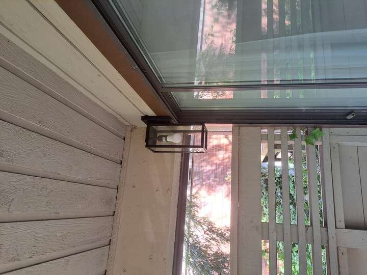 Outdated light fixture replaced with modern one
