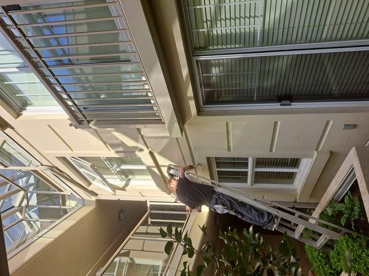 Handyman doing exterior painting
