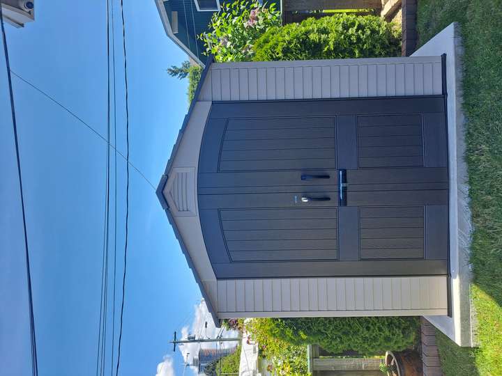 Fully assembled shed by Hennessey Handyman