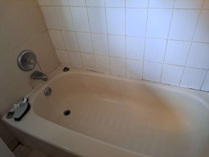 before recaulking dirty bathtub